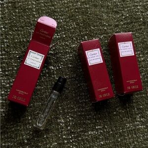 Three mini bottles of Cartier perfume